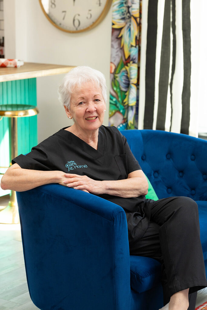 Professional senior caregiver seated inside the Senior Care at Home facility in Oklahoma City