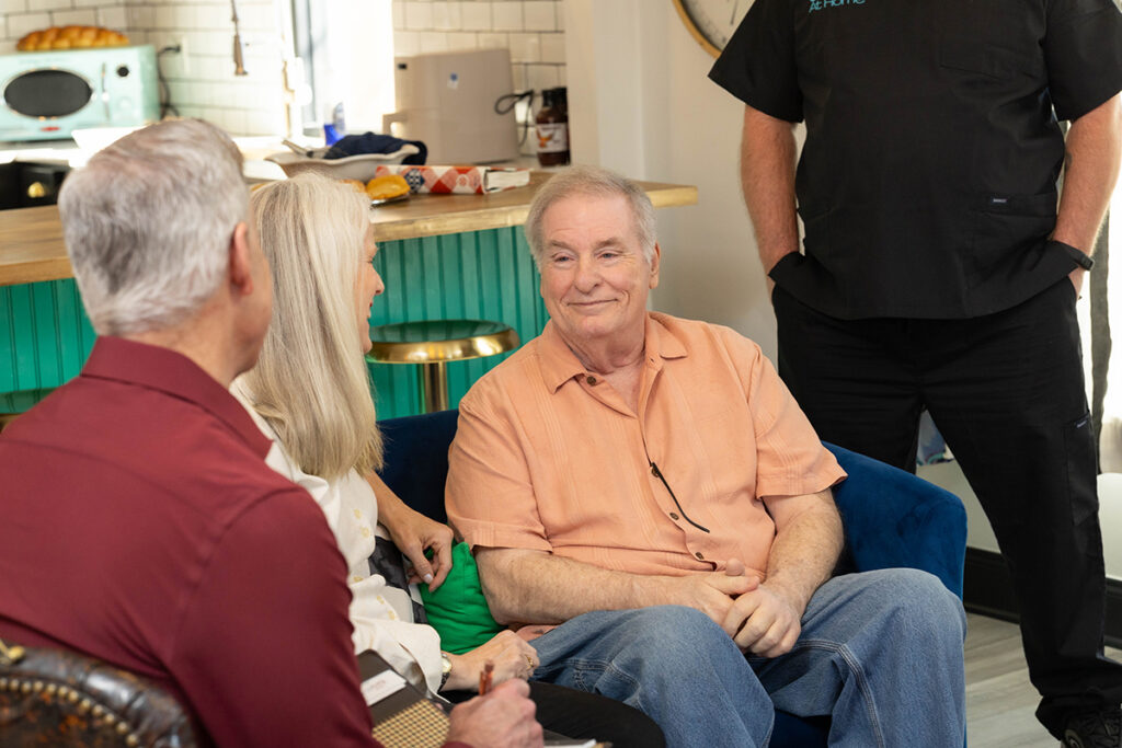 How to talk to seniors about caregiving, family and caregiver having a supportive conversation at home, demonstrating how to talk to your parents about senior living with helpful resources for caregivers